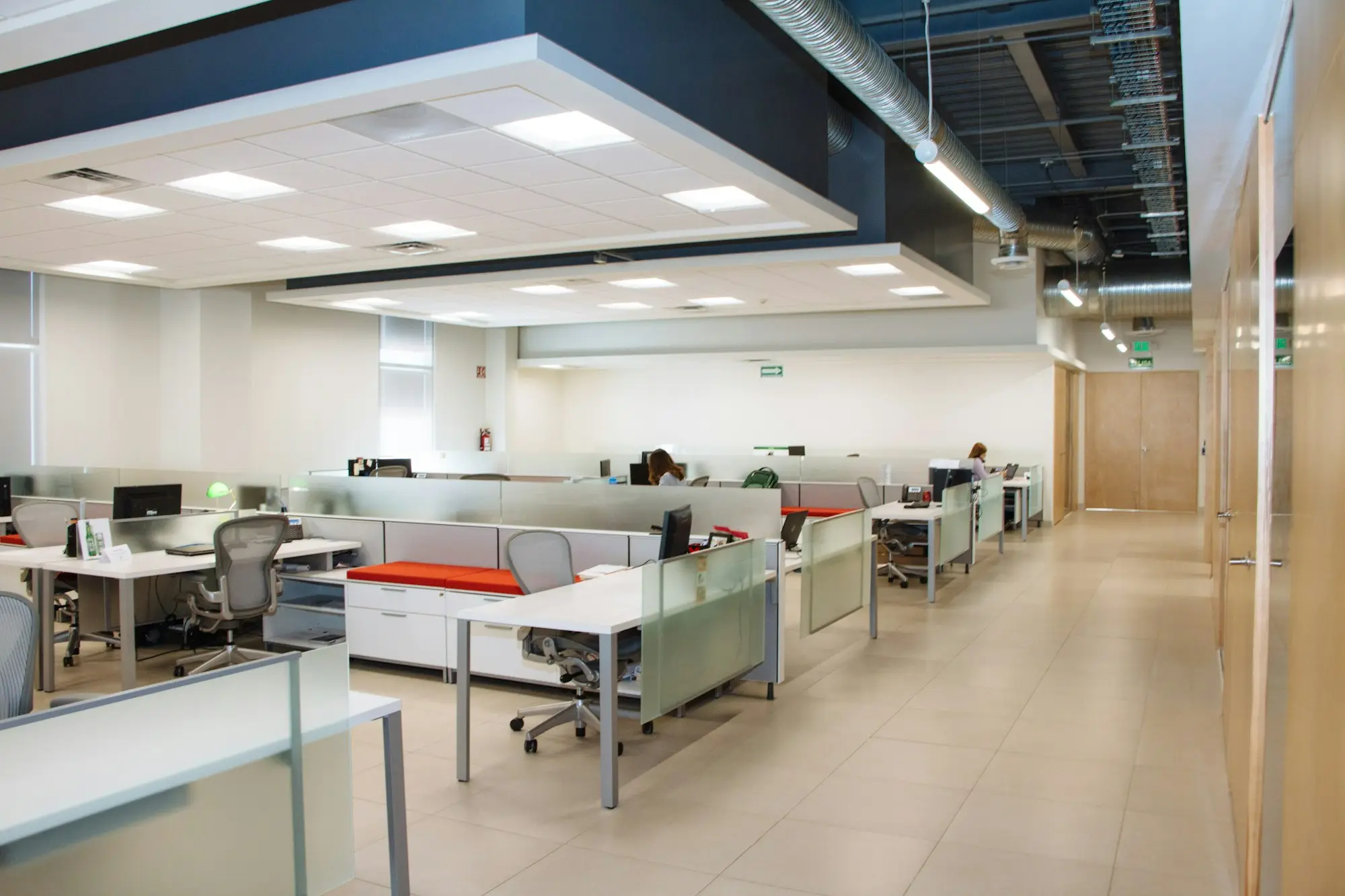 Open plan office with rows of desks, a growing business weighing up a term loan