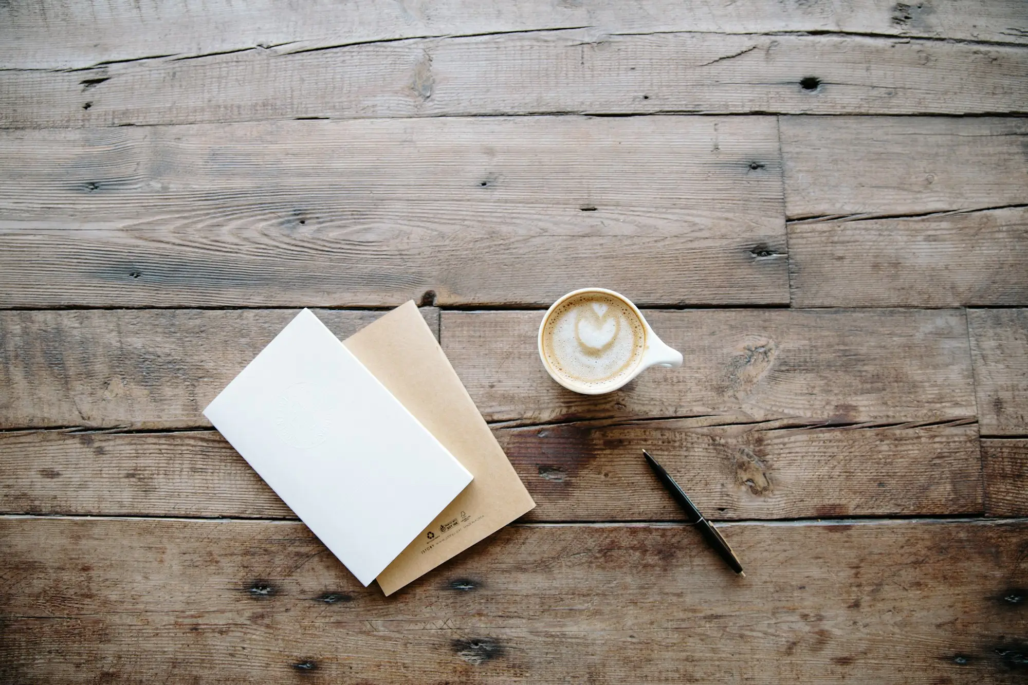 Pen beside a teacup on a desk, preparing the paperwork a lender asks for